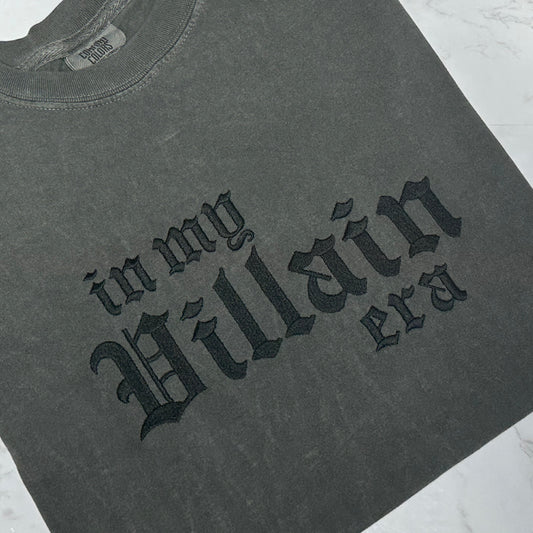Pepper t-shirt with black gothic text reading “in my villain era” across the front.