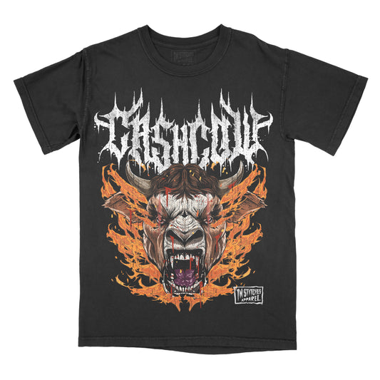 A black graphic tee with a large, vibrant print of a cow, surrounded by flame designs, and the text 'CASH COW' across the top.