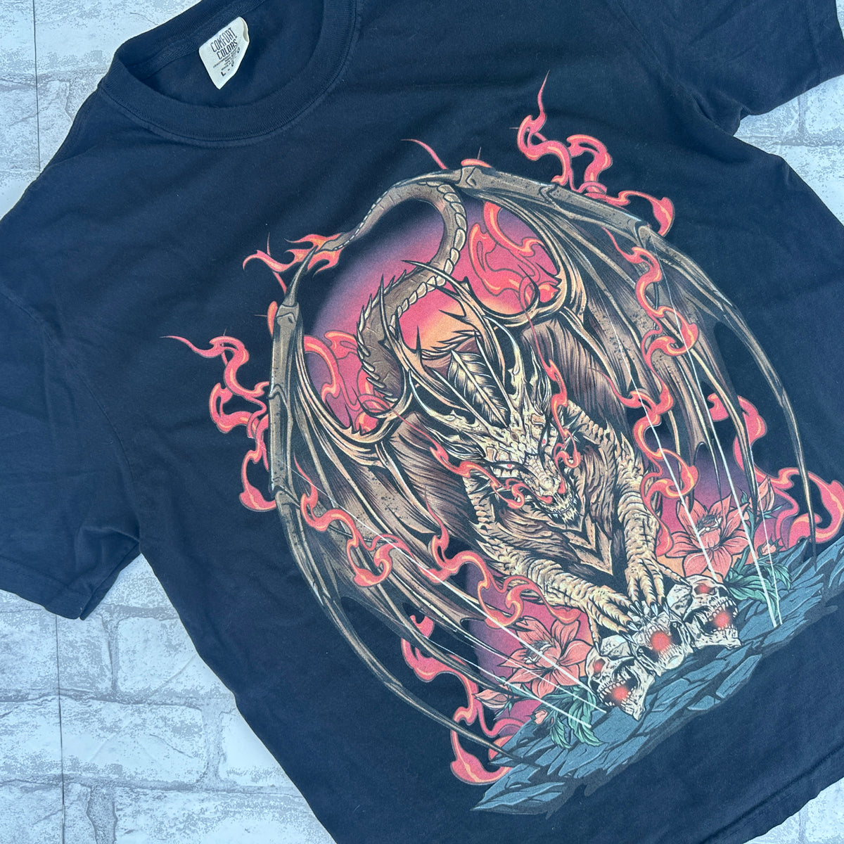 A black graphic tee with a vibrant illustration of a dragon in flames.