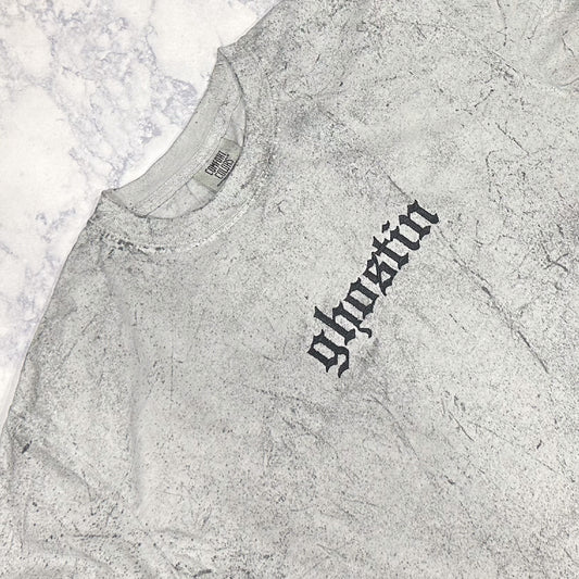 Light gray mineral-washed short-sleeve T-shirt laid flat, featuring small tonal embroidered text reading “ghostin” on the chest.