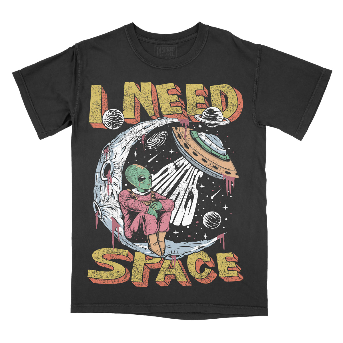A black graphic tee with a design that includes a stylized alien and the text 'I NEED SPACE' on the front.