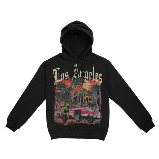 Black pullover hoodie featuring the phrase ‘Los Angeles’ above a colorful illustration of palm trees, a lowrider car, and a sunset city scene. Zombie girl models by car