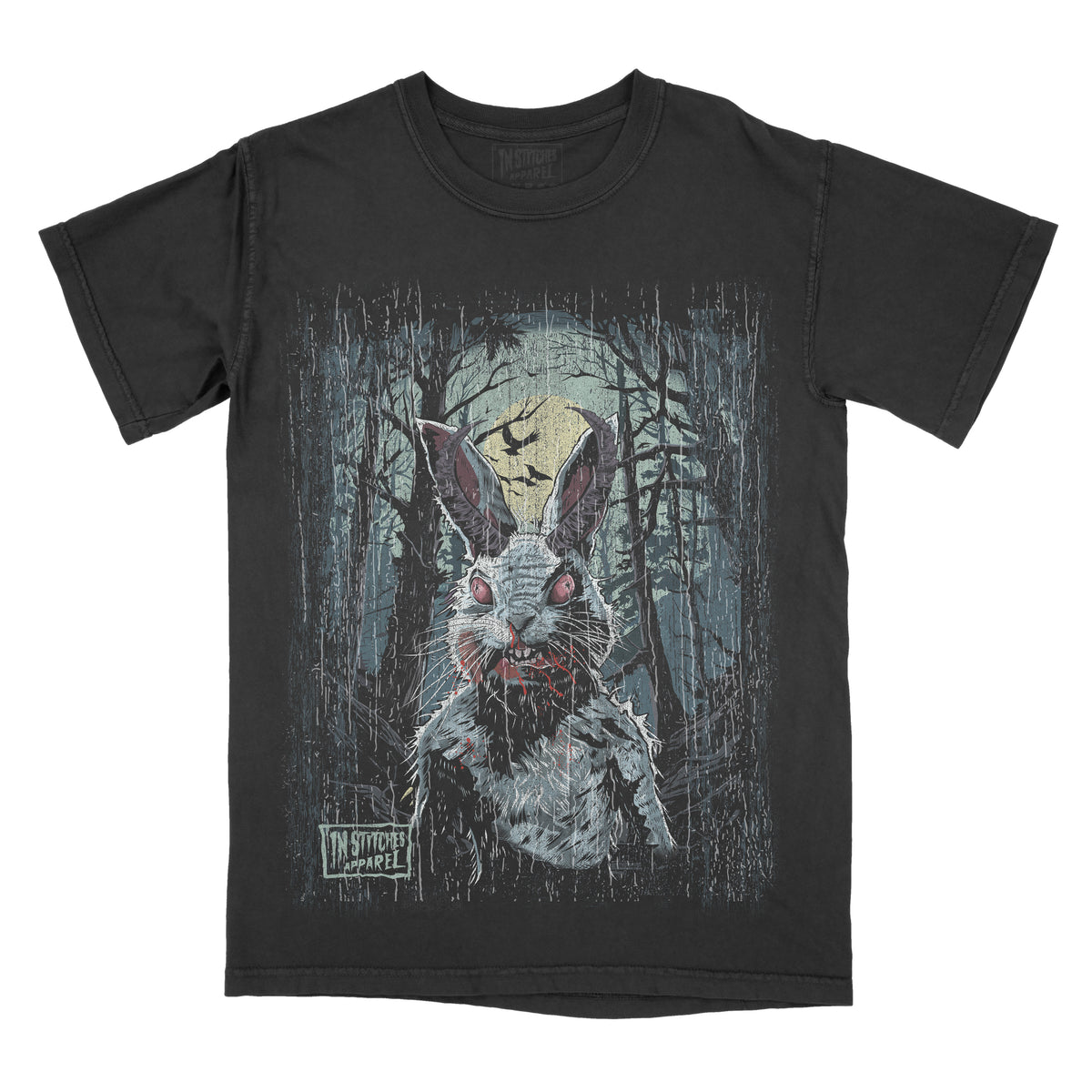 Black T-shirt featuring a creepy white rabbit with glowing red eyes and blood around its mouth standing in a dark forest. A full moon and flying bats appear in the background, creating a spooky horror scene.