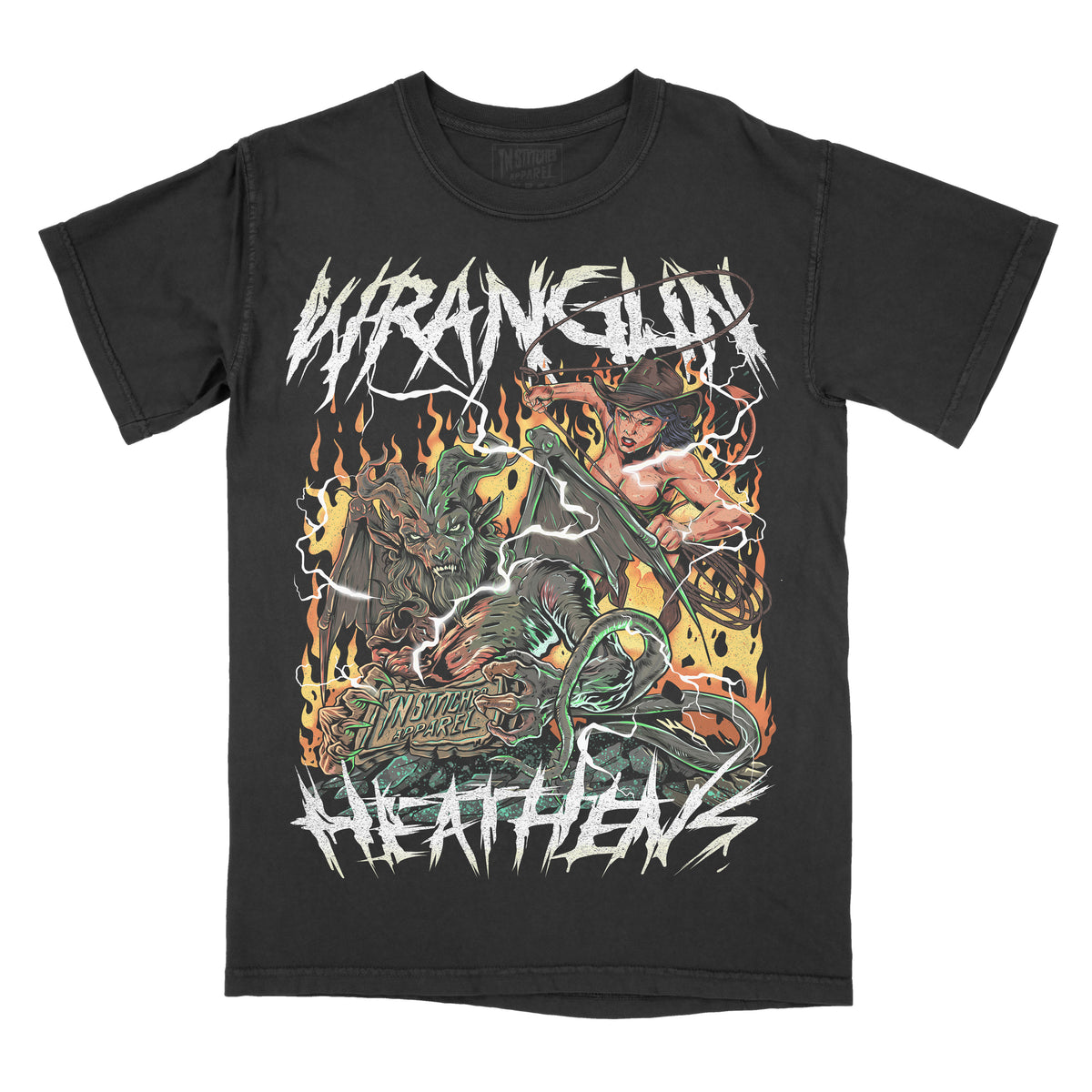 Black graphic t-shirt featuring the phrase “Wranglin’ Heathens” in jagged lettering above and below a fiery illustration of a cowgirl fighting a horned creature with flames and western horror details.