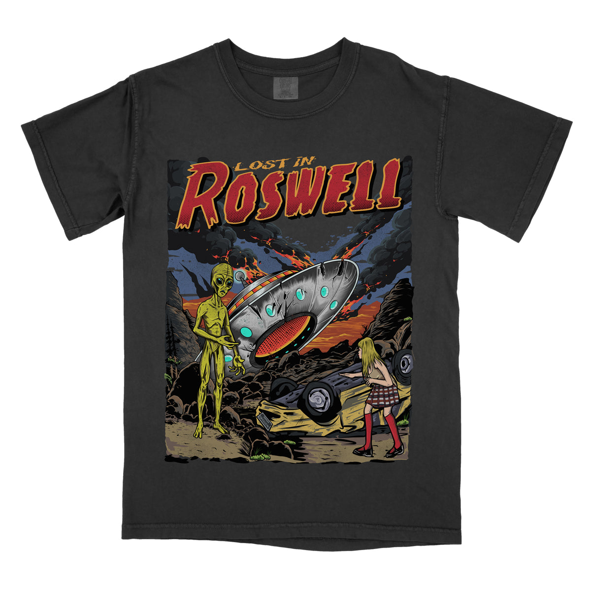 Black t-shirt  featuring a retro sci-fi graphic with an alien, a flying saucer, and a desert scene, with ‘Lost in Roswell’ text above the artwork.