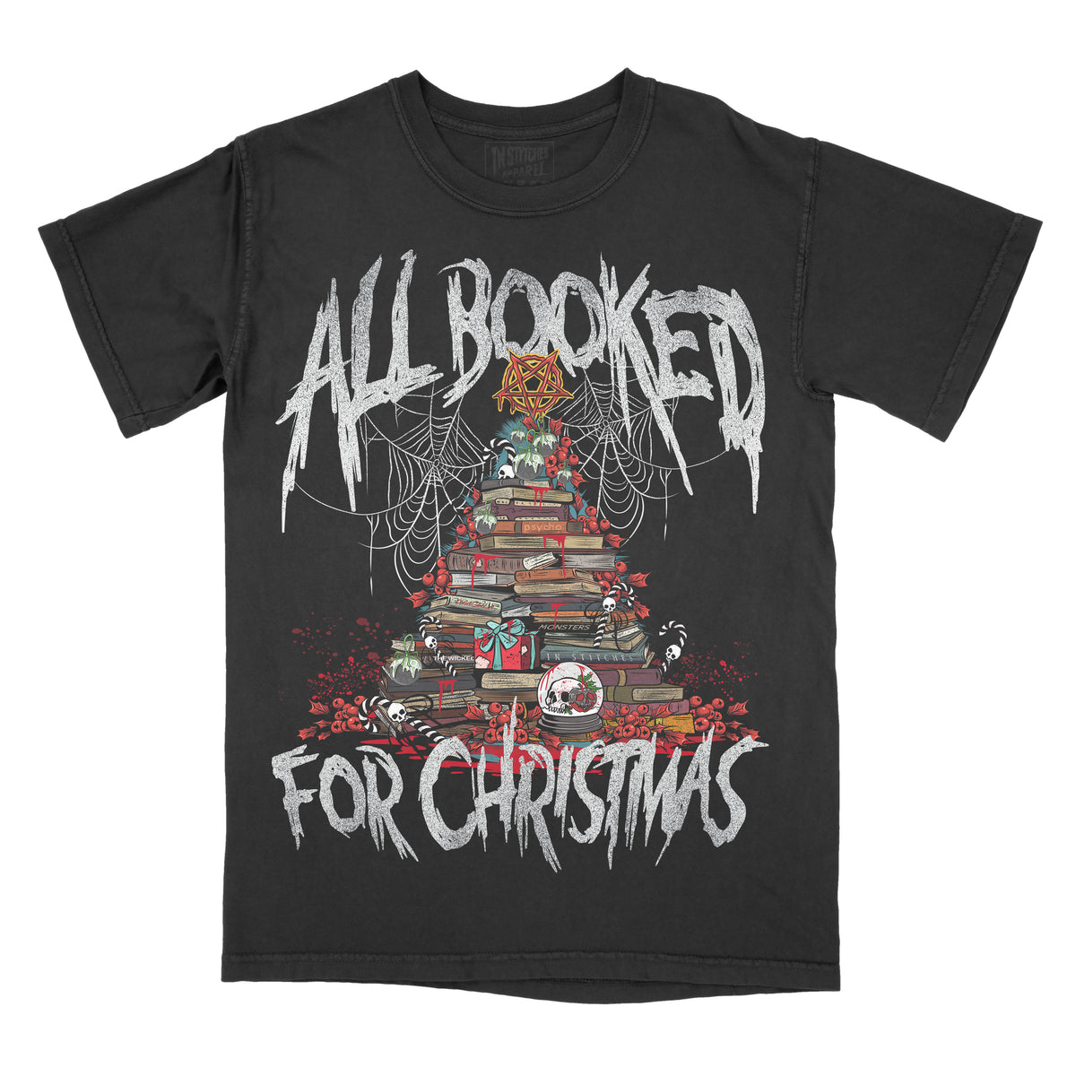 Black graphic tee with a Christmas-themed design featuring a tree made out of books, decorations, and the text 'All Booked For Christmas'.