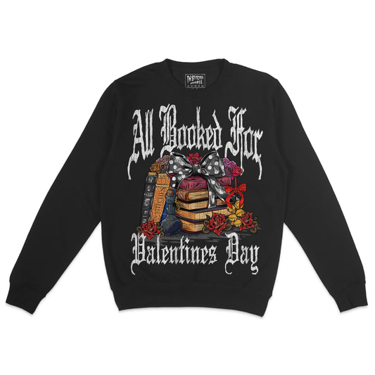 A black crewneck sweatshirt with 'All Booked for Valentine's Day' text and a graphic design featuring a bow, books, and flowers.