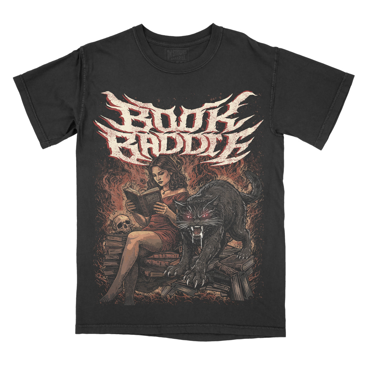 A black graphic t-shirt featuring the text 'Book Baddie' in a stylized white and red font above an illustration of a woman reading, a large black cat, and a skull on a fiery background.