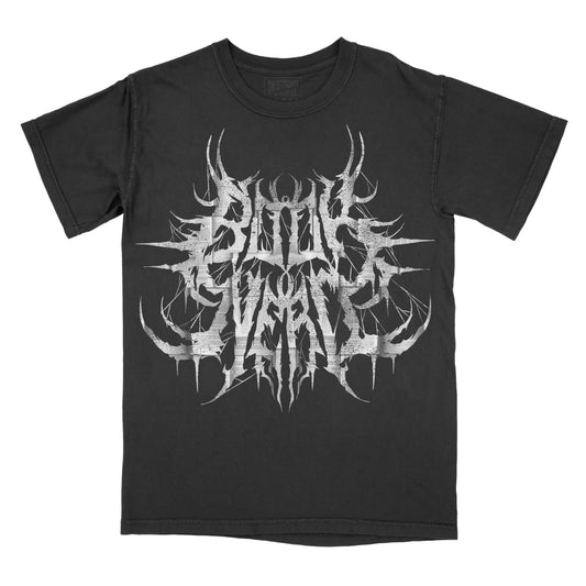 Black graphic t-shirt displaying the words "Book Nerd" in a stylized heavy metal logo with distressed white lettering and decorative thorn-inspired details.