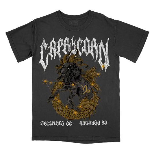 Pepper graphic t-shirt featuring a Capricorn zodiac design with a goat illustration, constellation accents, and dates December 22 to January 19.