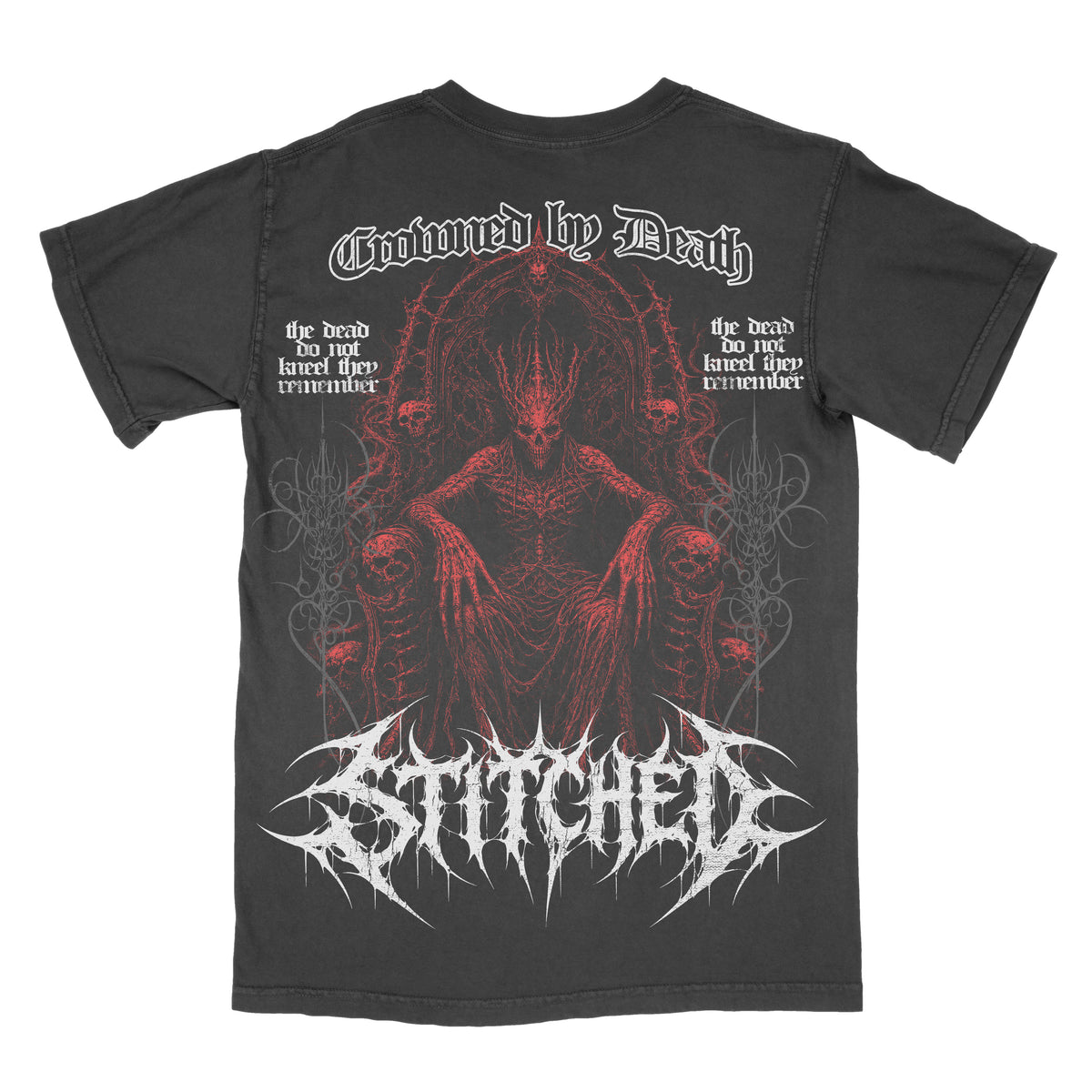 Back of a black vintage-wash Crowned by Death graphic tee featuring a red skeletal demonic figure seated on a throne surrounded by skulls and gothic details. White “Crowned by Death” lettering appears across the top with an oversized white Stitched logo across the bottom.