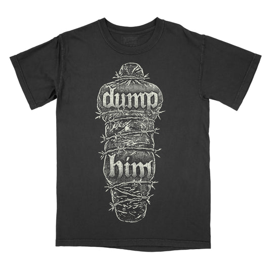 Black garment-dyed graphic t-shirt featuring the phrase "Dump Him" in distressed gothic lettering on a body bag wrapped in barbed wire, creating a dark horror-inspired alternative design.