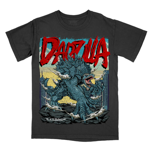 Black graphic T-shirt shown from the front featuring a roaring blue monster emerging from rubble with the red text “DADZILLA” across the top.