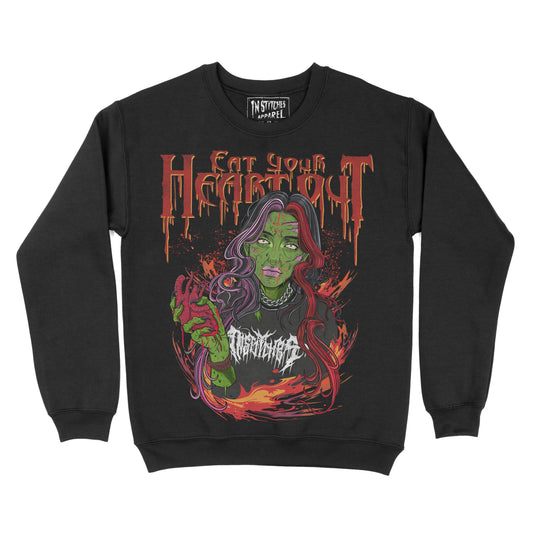 Black crewneck sweatshirt with a graphic print of a character and text 'EAT YOUR HEART OUT' on the front.