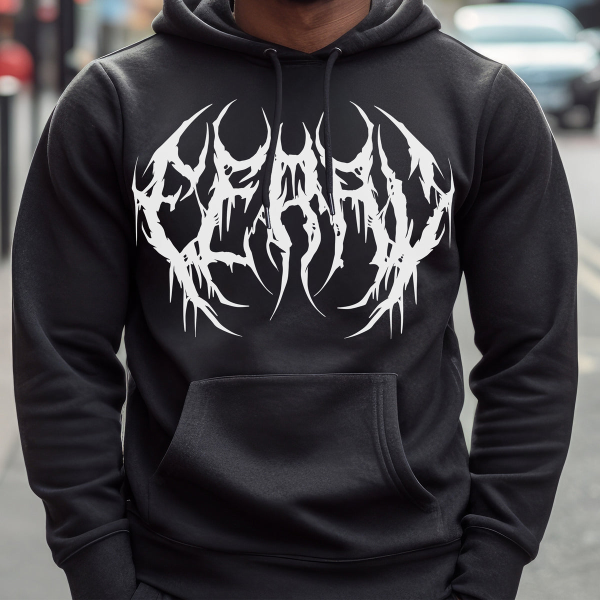 Model wear Black hoodie featuring white metal-style text reading “feral” across the chest.