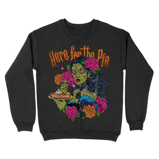Black crewneck sweatshirt with a graphic print of a zombie character eating a pie, surrounded by floral elements and the text 'HERE FOR THE PIE'.