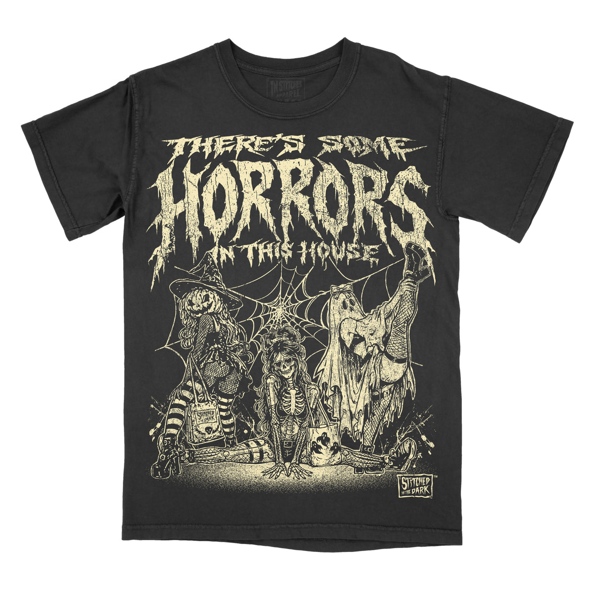Black vintage wash T-shirt featuring three spooky girls in witch, skeleton, and ghost costumes with spiderwebs and the phrase “There’s Some Horrors in This House.”