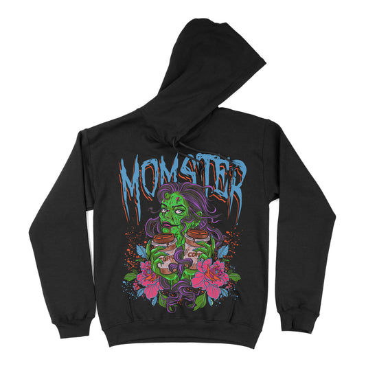 Black hoodie with a graphic print of a green monster character holding a coffee cup, surrounded by floral designs and the text 'MOMSTER'.