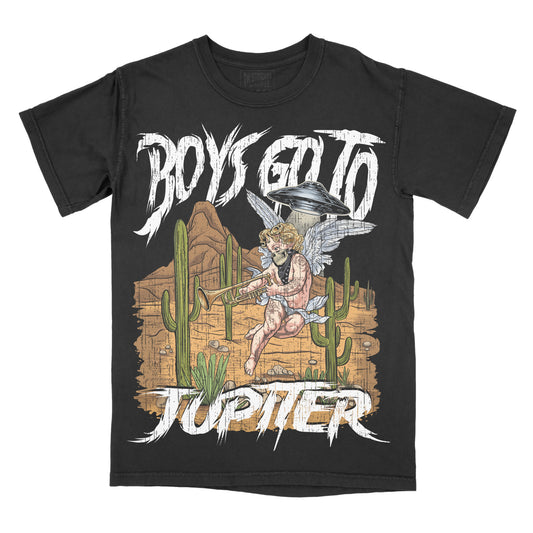 A black short-sleeve graphic t-shirt featuring a stylized illustration of a winged male figure riding a horse across a desert with cacti, with the text 'BOYS GO TO JUPITER' in a distressed white font.