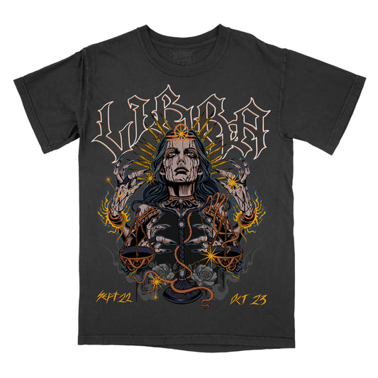 Graphic tee with a design featuring a female figure with hands extended and surrounded by a fiery, ornate border with the word 'LIBRA' above and the date '11/23/21' below. The tee is black with white and pepper accents.