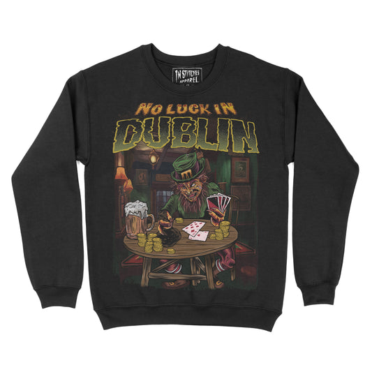 Black crewneck sweatshirt  with a graphic reading “No Luck in Dublin,” featuring a leprechaun playing cards at a wooden table with beer mugs and gold coins.