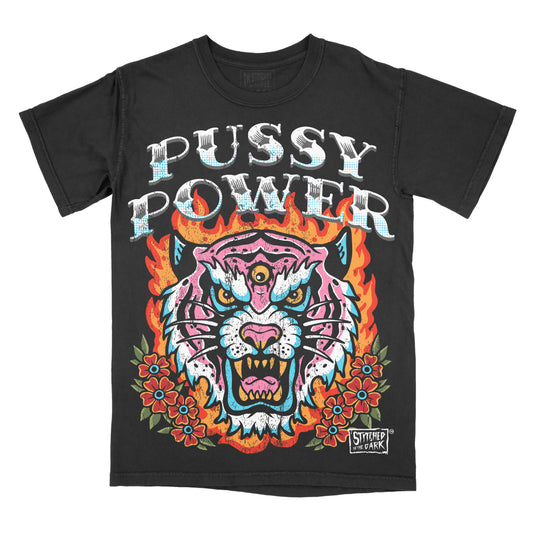 Black vintage wash T-shirt featuring a colorful traditional tattoo-style three-eyed tiger surrounded by flames and flowers with the phrase “Pussy Power.”