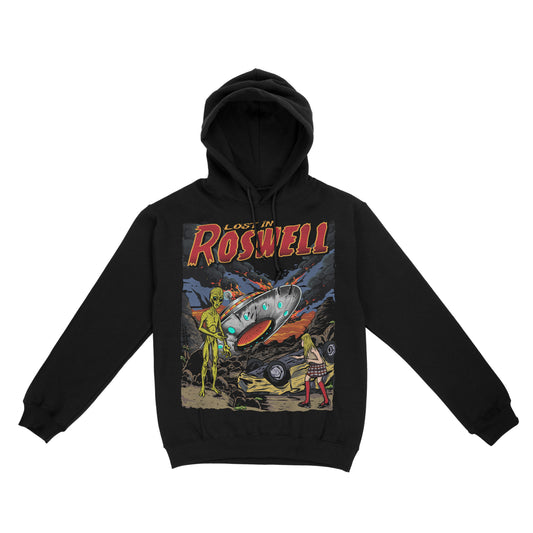 Black pullover hoodie featuring a retro sci-fi graphic with an alien, a flying saucer, and a desert scene, with ‘Lost in Roswell’ text above the artwork.