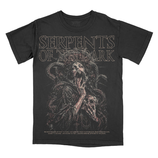 Black vintage-wash graphic tee featuring a dark gothic woman surrounded by coiled serpents, roses, and occult-inspired details, with “Serpents of the Dark” across the top in distressed lettering.