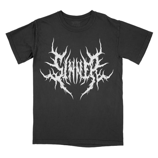 Black T-shirt featuring the word "SINNER" in a white heavy metal-inspired font with mirrored, jagged lettering, sharp thorn-like spikes, and pointed symmetrical details.