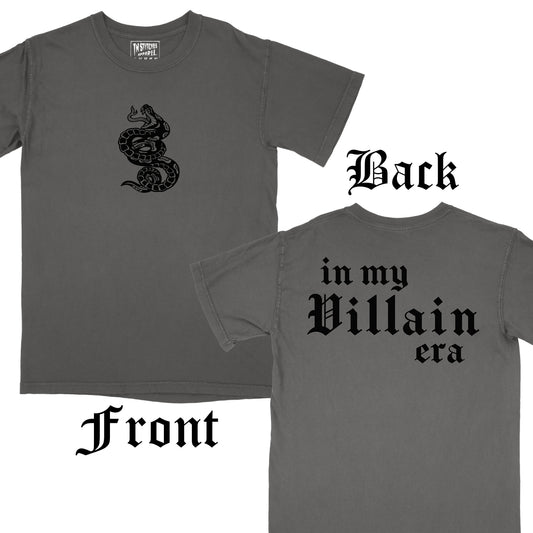 Front and back view of a pepper t-shirt with a black printed snake design on the front and the phrase 'in my Villain era' on the back.