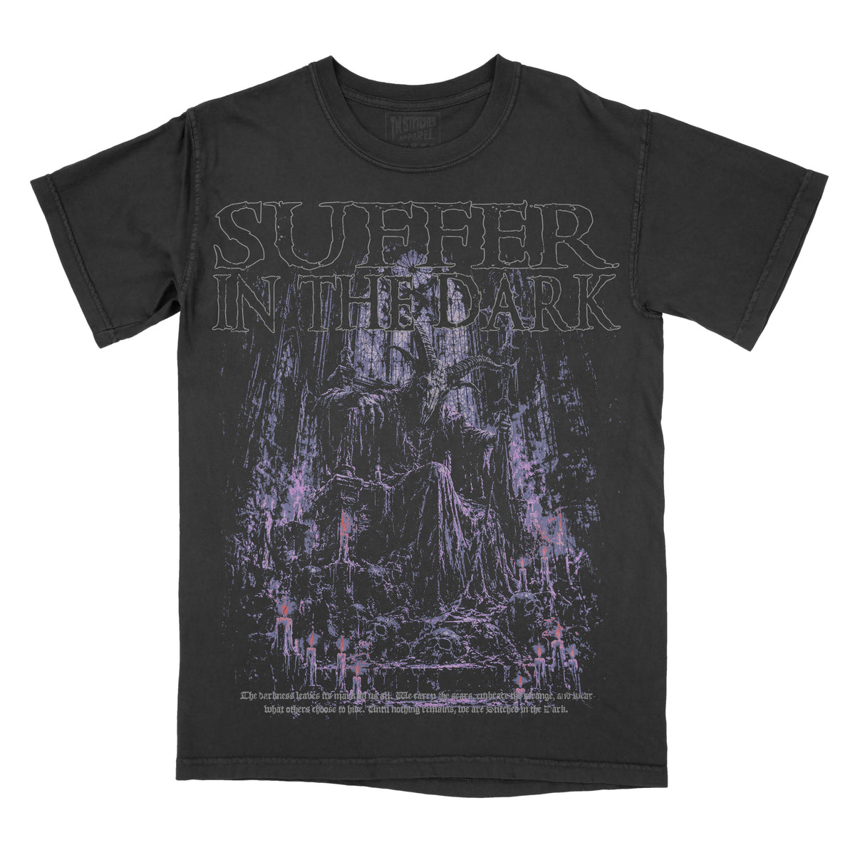 Black vintage-wash graphic tee featuring “Suffer in the Dark” across the chest above a shadowy gothic figure seated in a dark forest, illustrated in distressed purple, lavender, and muted pink tones.