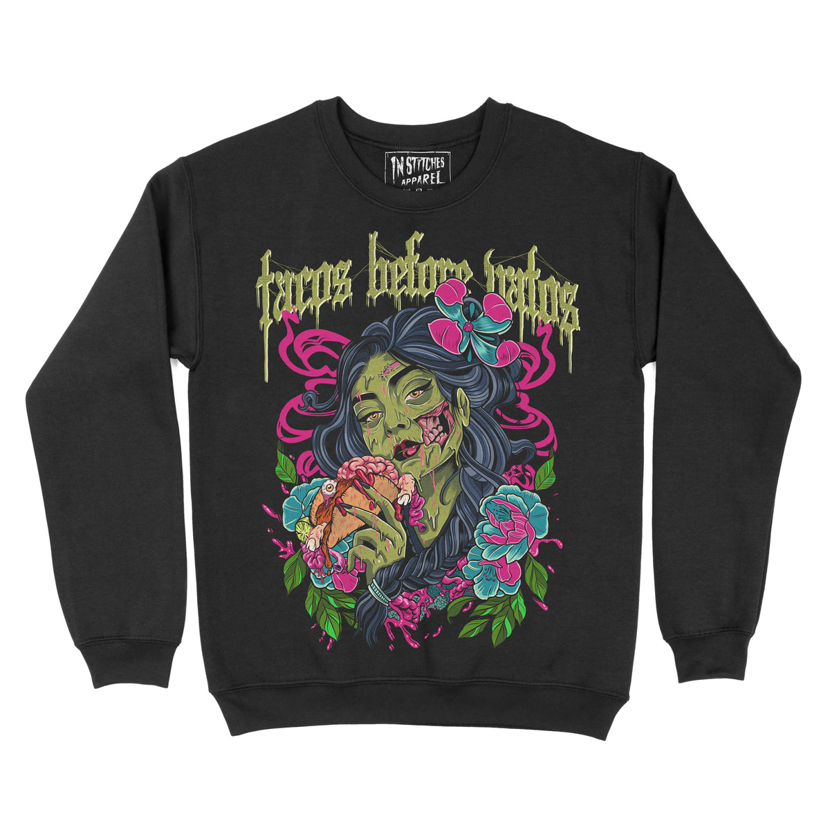 Black crewneck sweatshirt with the phrase ‘Tacos Before Vatos’ above a colorful gothic illustration of a woman holding a taco surrounded by flowers