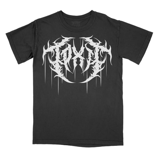 Black T-shirt featuring the word "TOXIC" in a white heavy metal-inspired font with mirrored, jagged lettering, flame-like spikes, and long dripping details.