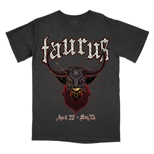 Pepper Comfort Colors graphic T-shirt with gothic “Taurus” lettering and a detailed red colored bull skull illustration, April 20 – May 20 zodiac design.
