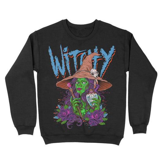 A black crewneck sweatshirt with a colorful illustration of a character resembling a witch, complete with a green hat and purple hair, holding a wand and a bottle, surrounded by a vibrant, decorative backdrop with the phrase witchy at the top. 