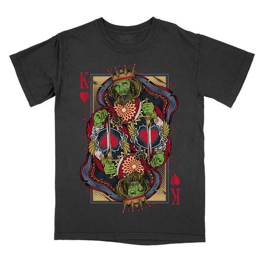 Black t-shirt featuring a bold King of Hearts playing card–style graphic with mirrored green figures, red heart symbols, and ornate gothic detailing on the front.